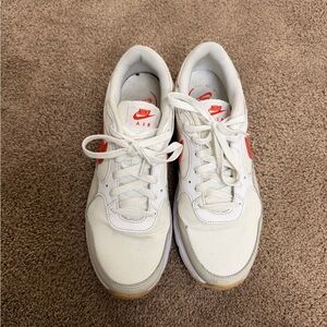 Nike White Sneakers with Orange Swoosh